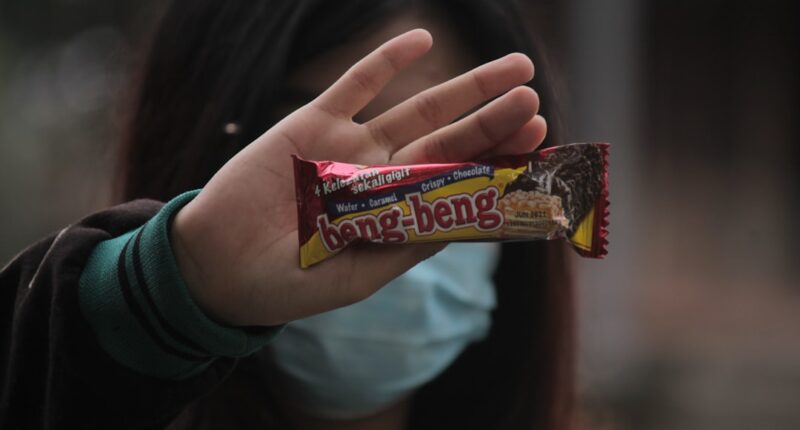 Photo Image: Person studying Nouns: Person, studying